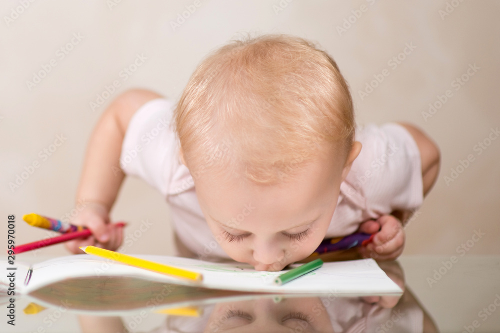 little child painted his parents and kisses his drawing little child painted his parents and kisses his drawing