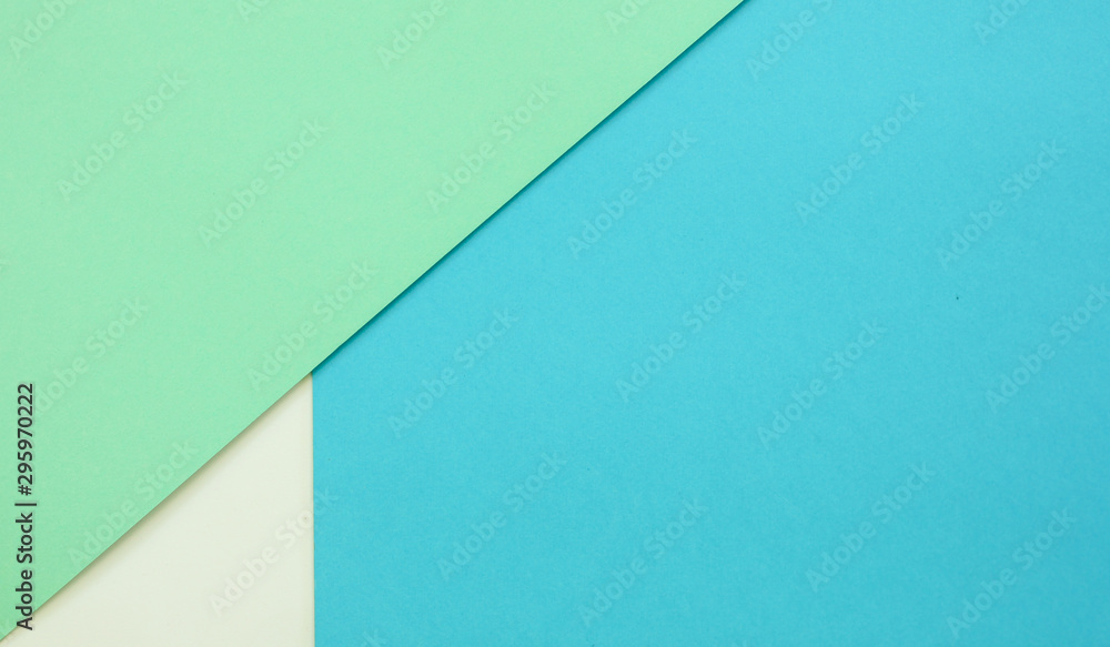 Multicolor paper background of treny mint, blue and white colors
