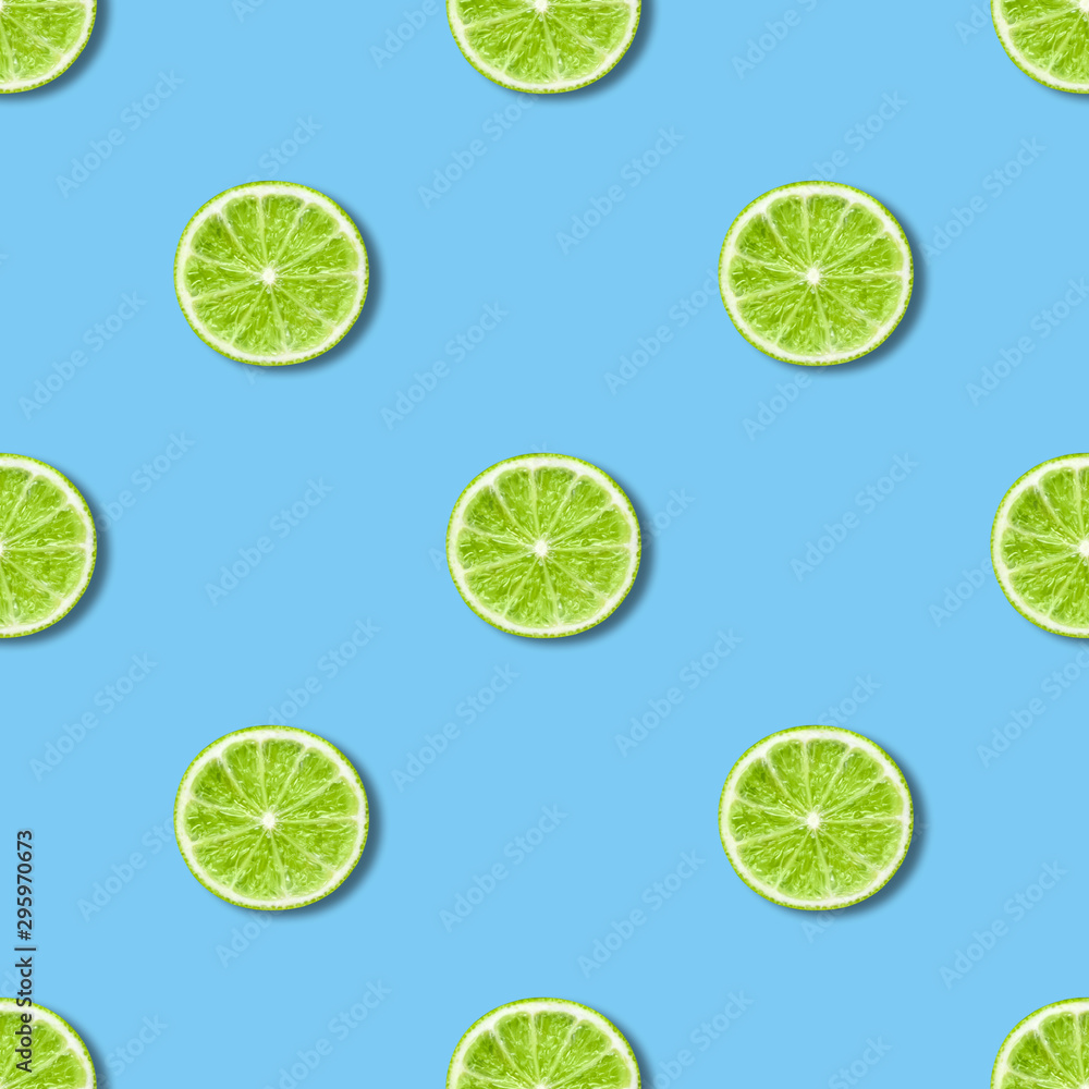 Seamless pattern with lime on blue background. Tropical abstract background. Minimal fruit concept