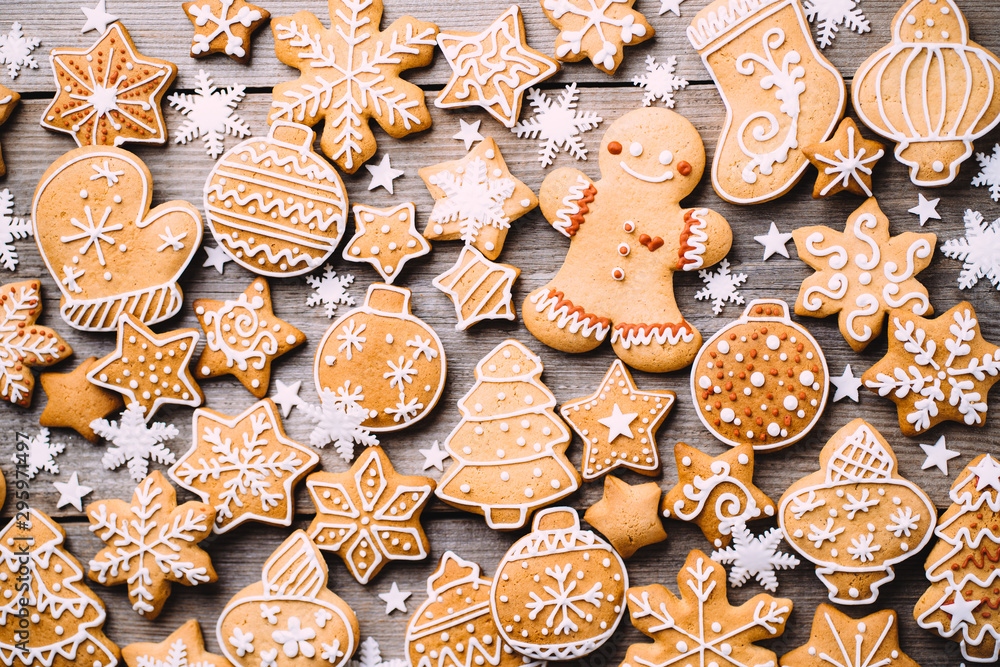 Christmas background, winter holidays, New Year party, celebration concept. Festive decorations, gift boxes and gingerbread on wooden background, greeting card template Christmas background, winter holidays, New Year party, celebration concept. Festive decorations, gift boxes and gingerbread on wooden background, greeting card template