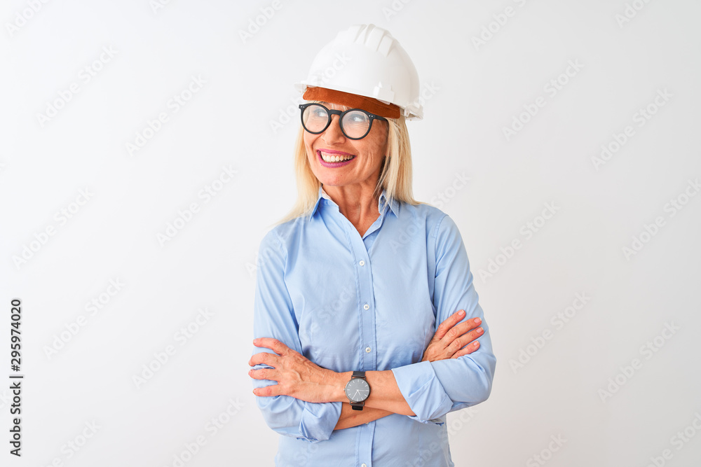 Middle age architect woman wearing glasses and helmet over isolated white background smiling looking to the side and staring away thinking. Middle age architect woman wearing glasses and helmet over isolated white background smiling looking to the side and staring away thinking.