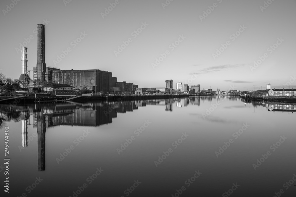 Cork Ireland city center harbor panorama view morning sunrise cold weather calm river water reflection buildings colors 