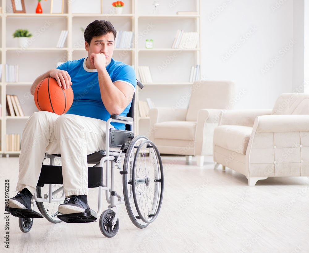 Young basketball player on wheelchair recovering from injury Young basketball player on wheelchair recovering from injury