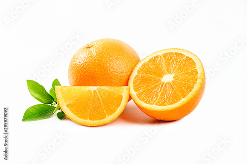 Fresh Orange with half and leaves isolated on white background