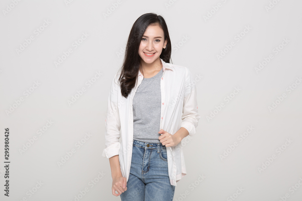 Portrait of young stylish freckled girl laughing with hand on cheek looking at camera. Copy space. Isolated on white Portrait of young stylish freckled girl laughing with hand on cheek looking at camera. Copy space. Isolated on white