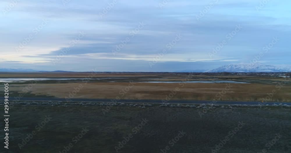 Drone Shot Of The Road Next To A Muddy Mountain Lake Marsh Drone Shot Of The Road Next To A Muddy Mountain Lake Marsh