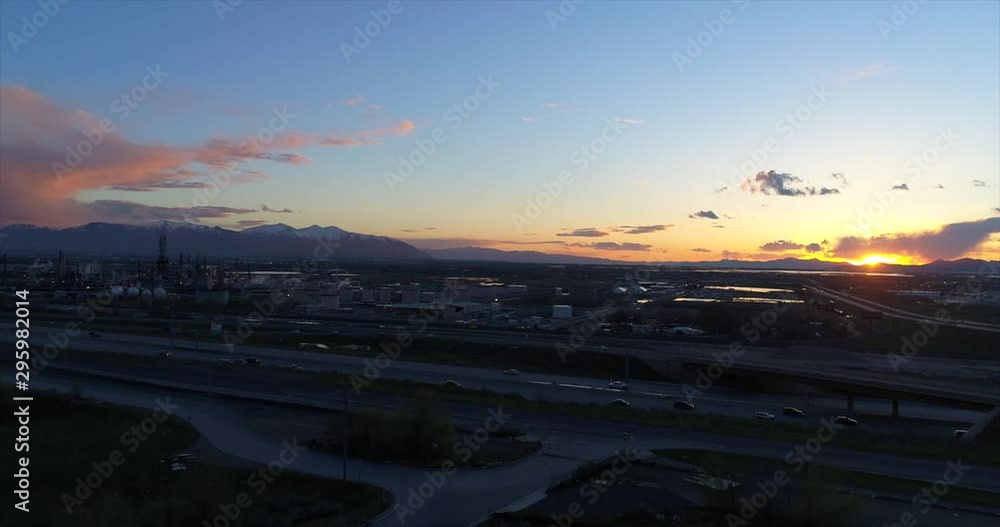 Drone Shot Flying Towards Oil Refinery And Freeway At Sunset Drone Shot Flying Towards Oil Refinery And Freeway At Sunset