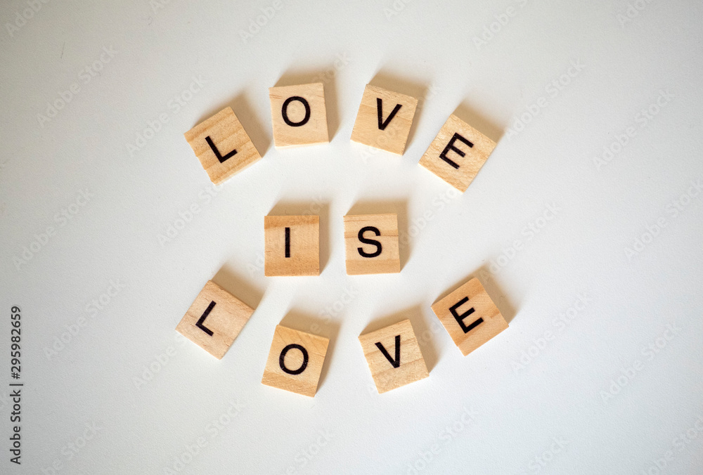 Love is love word tiles on a white background Love is love word tiles on a white background