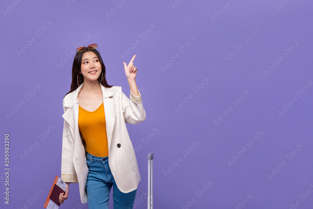 Asian woman tourist pointing hand to copy space Asian woman tourist pointing hand to copy space