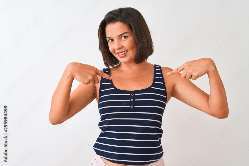 Young beautiful woman wearing blue striped t-shirt standing over isolated white background looking confident with smile on face, pointing oneself with fingers proud and happy. Young beautiful woman wearing blue striped t-shirt standing over isolated white background looking confident with smile on face, pointing oneself with fingers proud and happy.