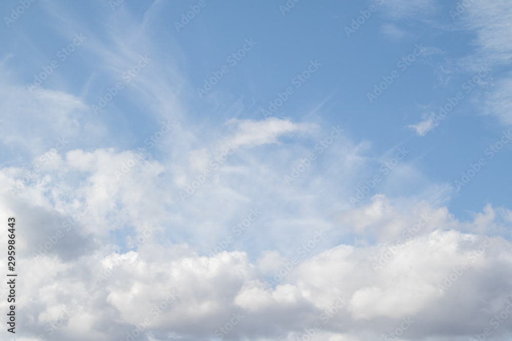 Blue sky with white clouds, sky concept on a clear day.