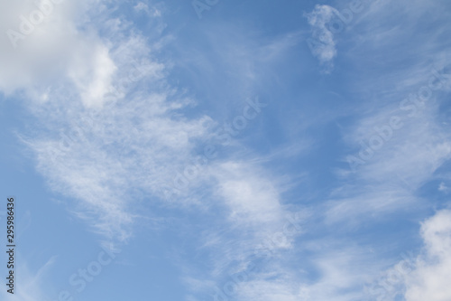 Blue sky with white clouds, sky concept on a clear day.