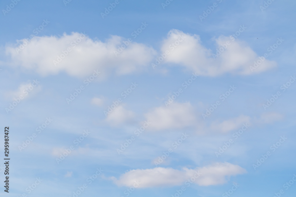 Blue sky background with white clouds. Clearly nice sky on blue.