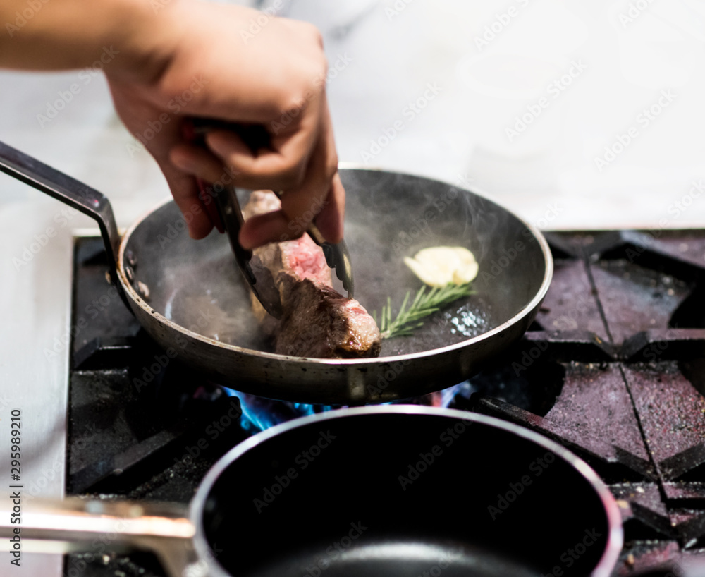 Chef cooking food in the kitchen, Chef preparing food Chef cooking food in the kitchen, Chef preparing food