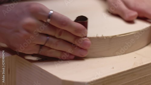 Guitar maker uses sandpaper on acoustic guitar sides