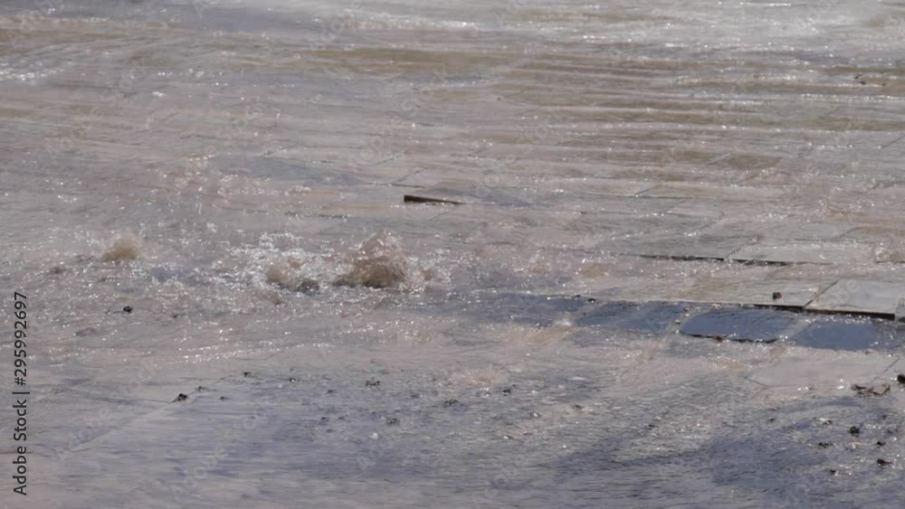 Pipe burst on a public paving in 180 fps slow motion Pipe burst on a public paving in 180 fps slow motion