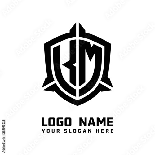 initial KM letter with shield style logo template vector. shield shape black monogram logo photo