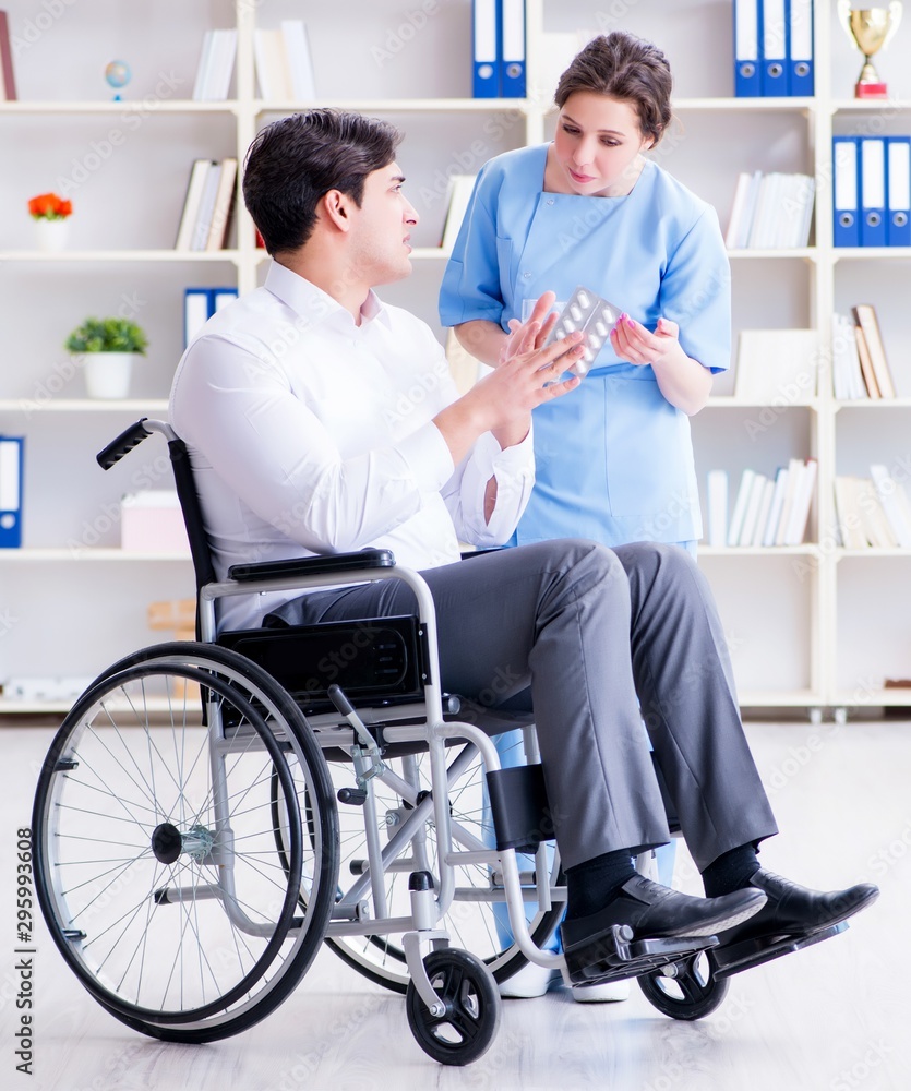 Disabled patient on wheelchair visiting doctor for regular check