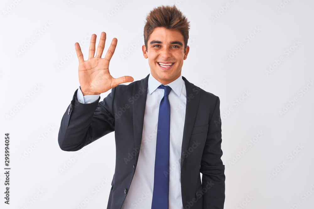 Young handsome businessman wearing suit standing over isolated white background showing and pointing up with fingers number five while smiling confident and happy. Young handsome businessman wearing suit standing over isolated white background showing and pointing up with fingers number five while smiling confident and happy.