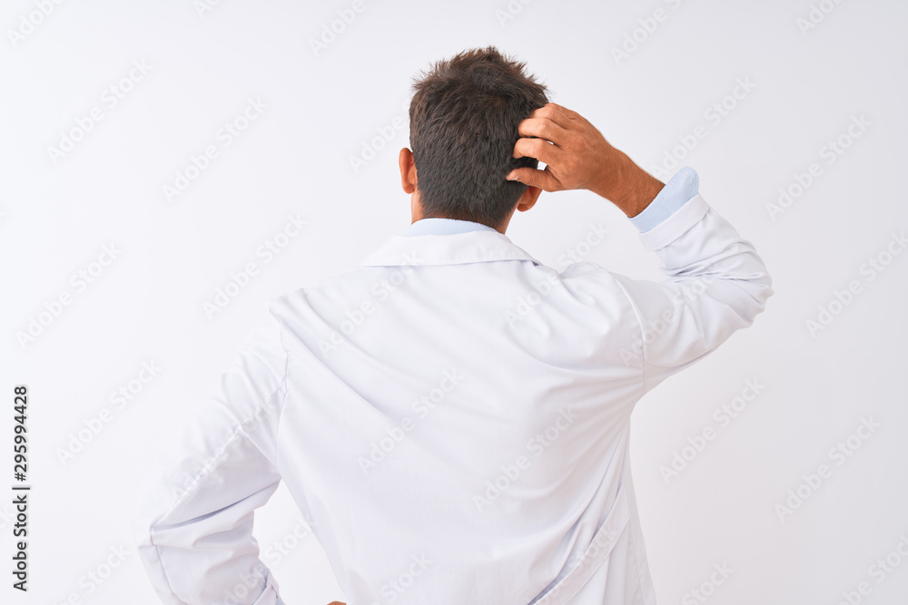 Young handsome sciencist man wearing glasses and coat over isolated white background Backwards thinking about doubt with hand on head Young handsome sciencist man wearing glasses and coat over isolated white background Backwards thinking about doubt with hand on head