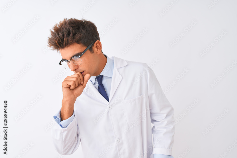 Young handsome sciencist man wearing glasses and coat over isolated white background feeling unwell and coughing as symptom for cold or bronchitis. Healthcare concept. Young handsome sciencist man wearing glasses and coat over isolated white background feeling unwell and coughing as symptom for cold or bronchitis. Healthcare concept.