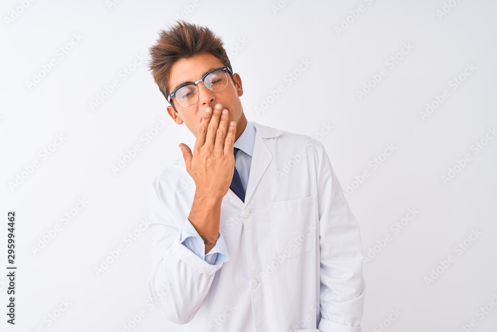 Young handsome sciencist man wearing glasses and coat over isolated white background bored yawning tired covering mouth with hand. Restless and sleepiness. Young handsome sciencist man wearing glasses and coat over isolated white background bored yawning tired covering mouth with hand. Restless and sleepiness.