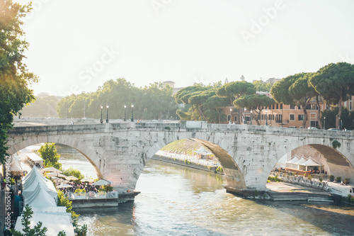 A bridge over the tiber river in Rome, Italy. © alexngm