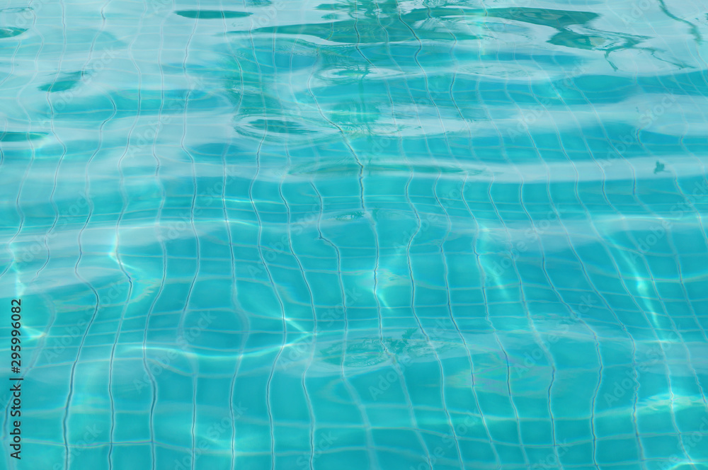 Background of rippled pattern of clean water in swimming pool 