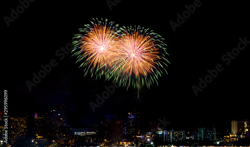 Happy new year fireworks over cityscape at night.holiday celebration festival © weedezign