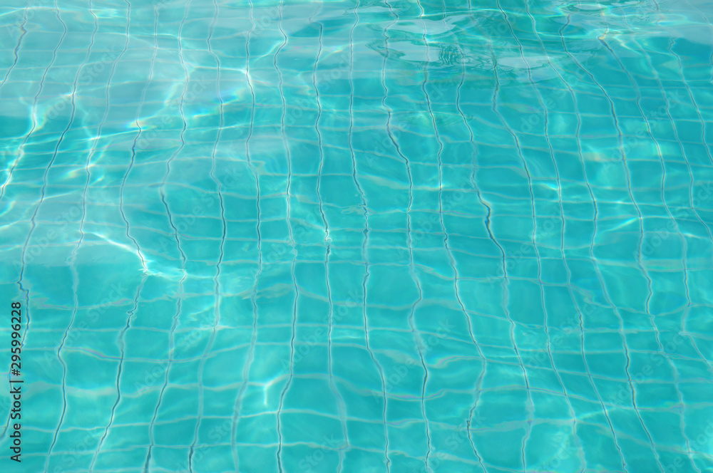 Background of rippled pattern of clean water in swimming pool 