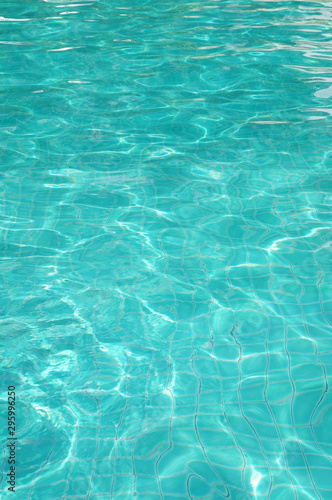 Background of rippled pattern of clean water in swimming pool  © Valerii Evlakhov