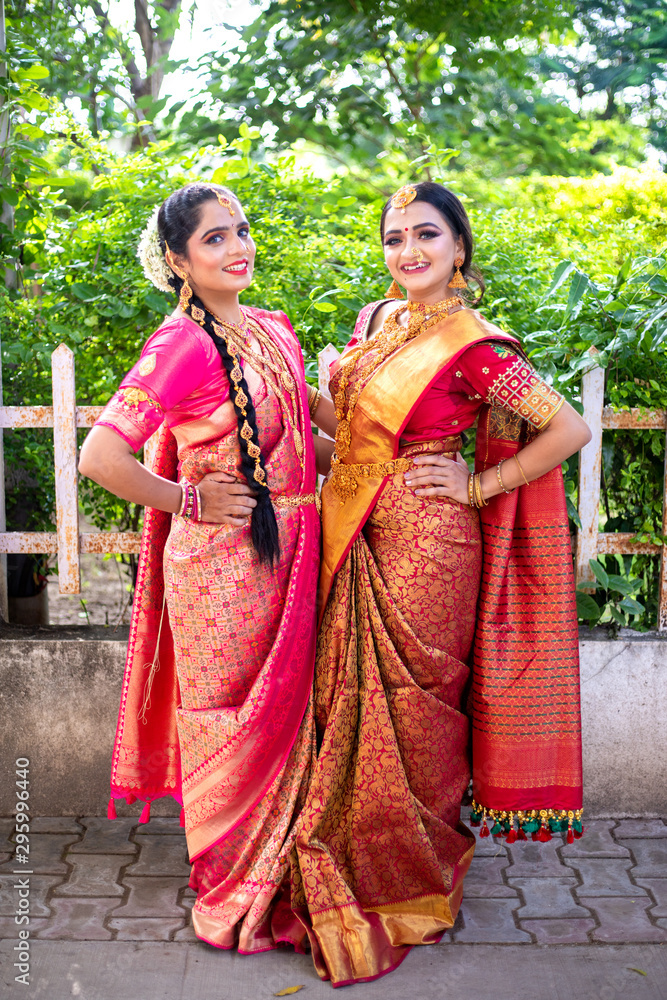Full length portrait of Indian women in traditional sari or saree 