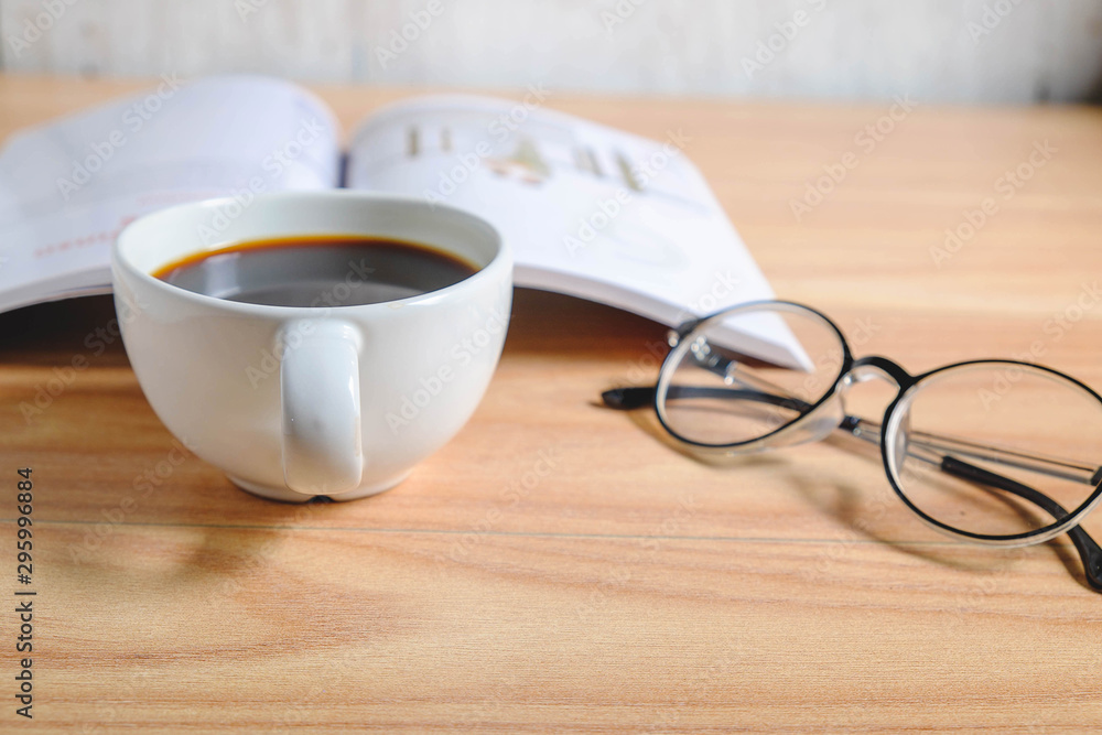 Coffee cup and book with glasses Coffee cup and book with glasses