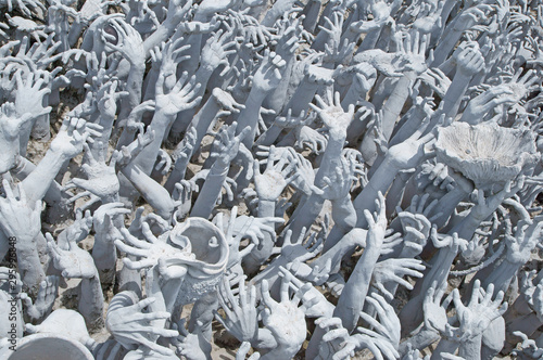 Wat Rong Khun (White Temple) is contemporary unconventional Buddhist temple in Chiang Rai Province, Thailand photo