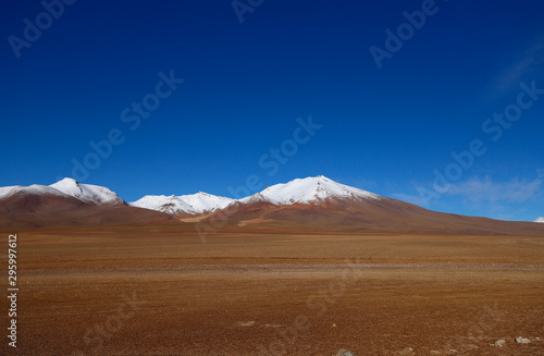 Landscape of Siloli Desert. Snow-capped volcanoes and desert landscapes in the highlands of Bolivia. Andean landscapes of the Bolivia Plateau