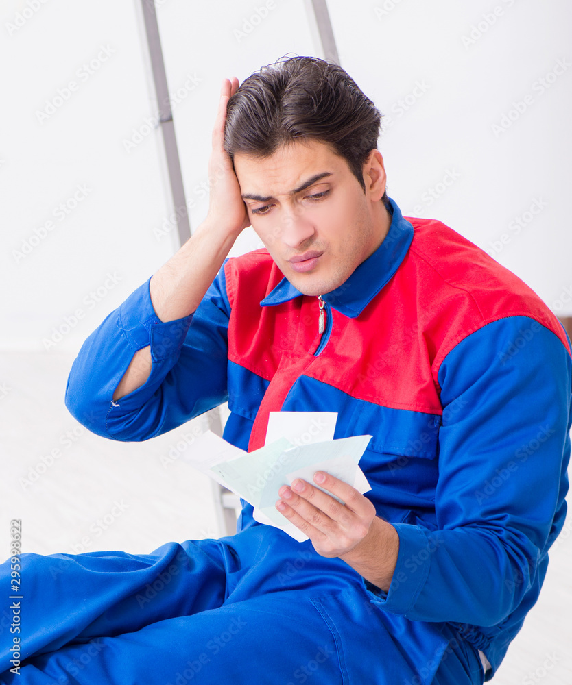 Young painter trying to match colours for painting job Young painter trying to match colours for painting job