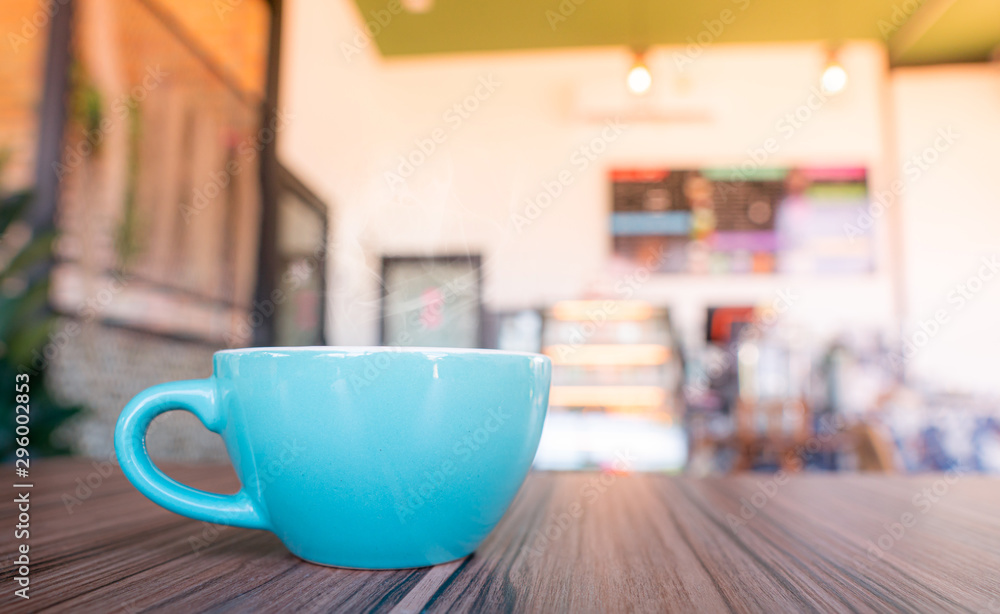 blue coffee cup top on wooden coffee shop background. blue coffee cup top on wooden coffee shop background.