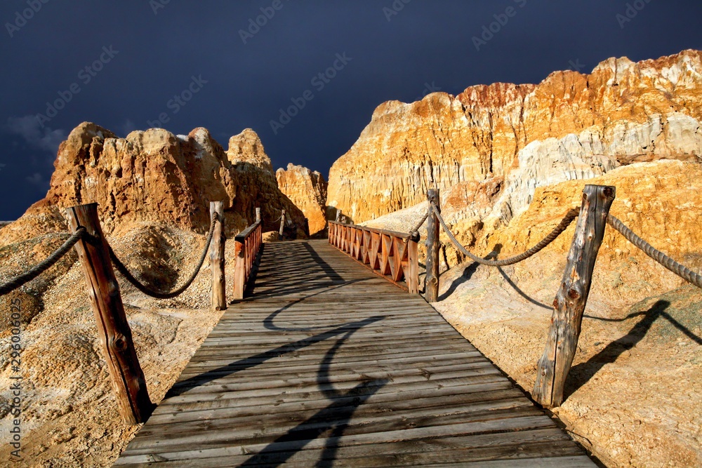 Trail with wooden railings between high hills in China Stock Photo ...
