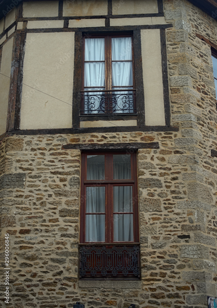 Old traditional French stone building with wooden windows Old traditional French stone building with wooden windows