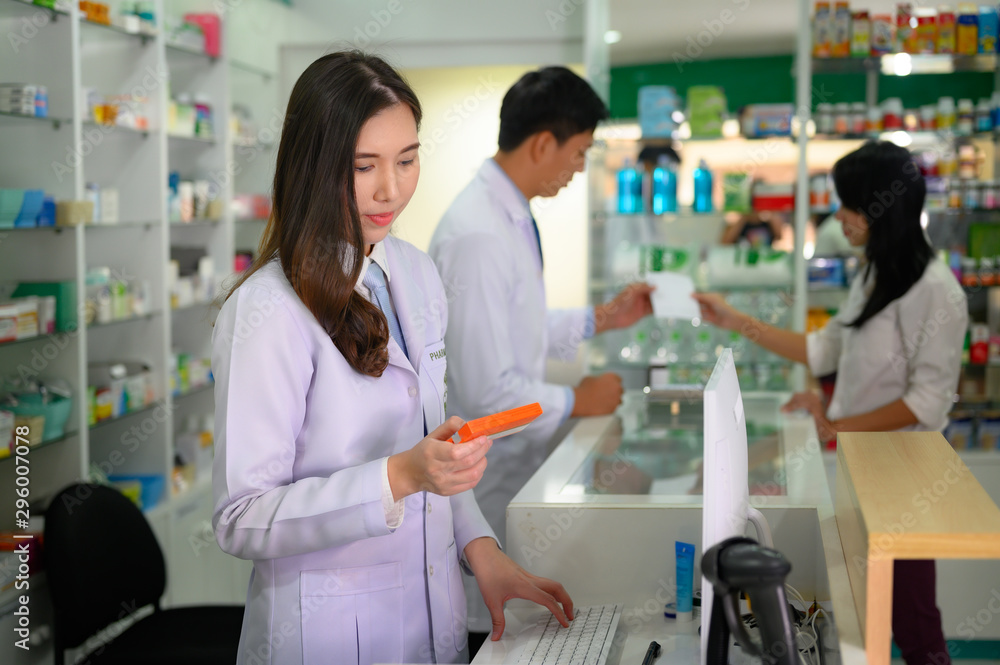 woman pharmacist holding box or case of medicine container, estimation cost of the pills in charge, with customer and consultant discussion prescribed in background