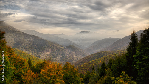 foggy mountains landscape in autumn season © Massimo De Candido