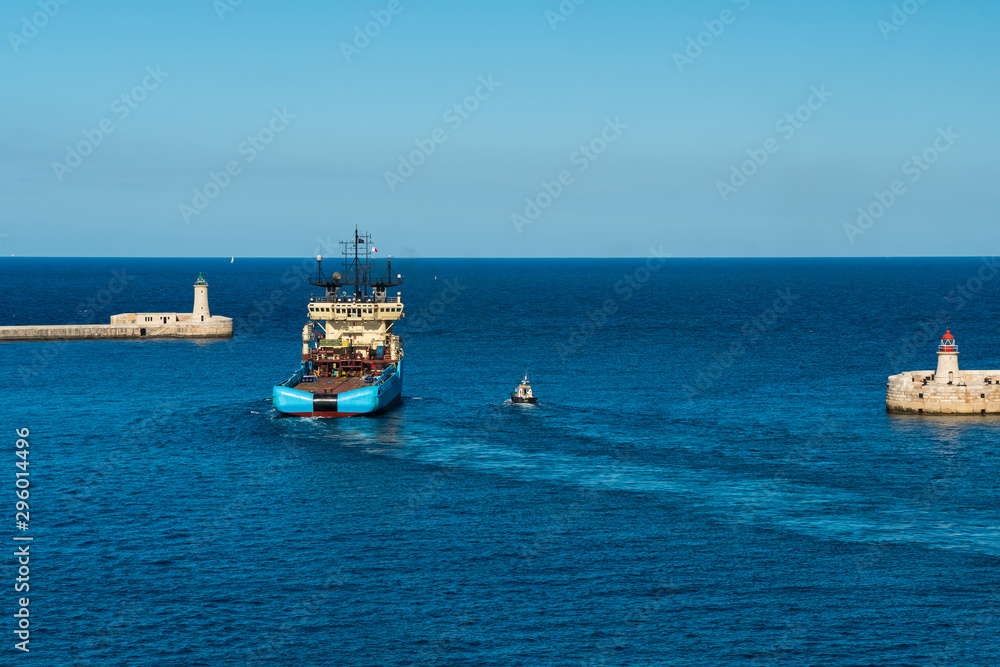 A Huge Transportation Ship Exiting the Port of Valetta