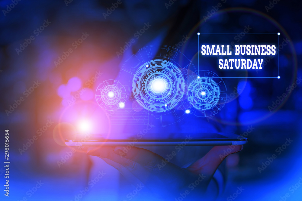 Text sign showing Small Business Saturday. Business photo text American shopping holiday held during the Saturday Woman wear formal work suit presenting presentation using smart device