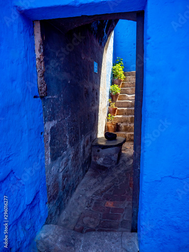 Blue interior passageway with stairs connecting rooms.   Saint Catherine Monastery (Convento de Santa Catalina), Arequipa City, Peru photo