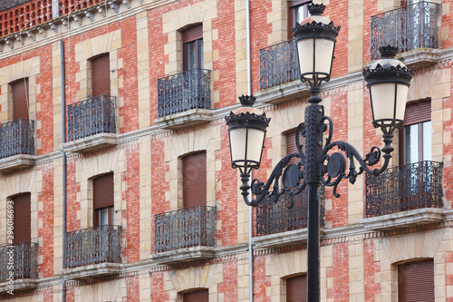 Traditional andalusian village facades and lamp in Baeza. Spain