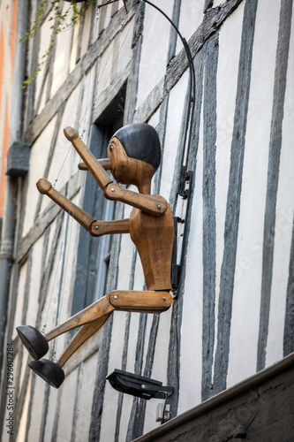  Pinocchio hung on the wall of the house in Troyes. Aube, Champagne-Ardenne, France