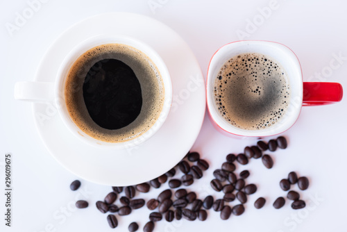 Top view of hot coffee cup and foam in white and red cup with beans isolated on white background and copy space.Coffee menu in the coffee shop or restaurant.