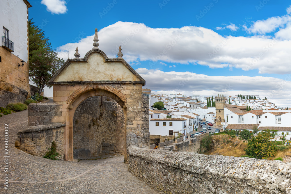 View of the city and the old stone gate. Ronda, Spain, Andalusia..