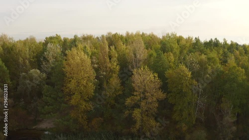 4k Morning over the autumn river and colorful trees aerial view  photo