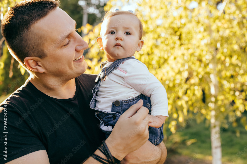 Fototapeta premium Happy younfather and her child enjoy the sunset outdoor - Image